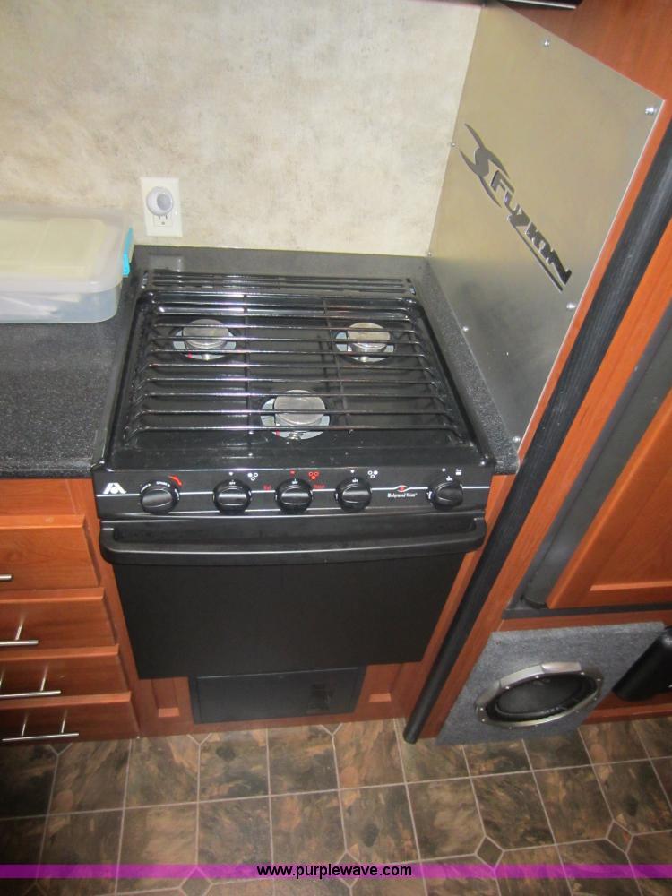 image for item C5426 2011 Keystone Fuzion toy hauler travel trailer