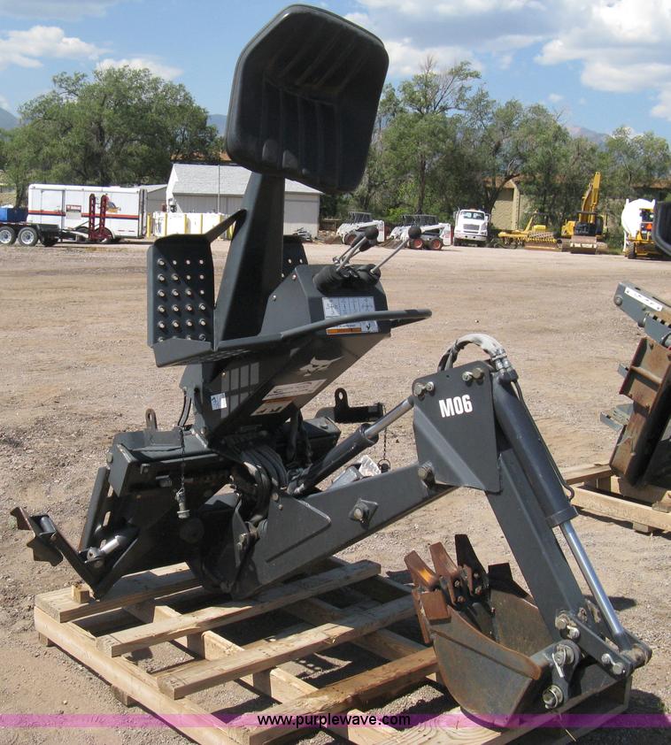 image for item B8090 Bobcat M06 backhoe skid steer attachment
