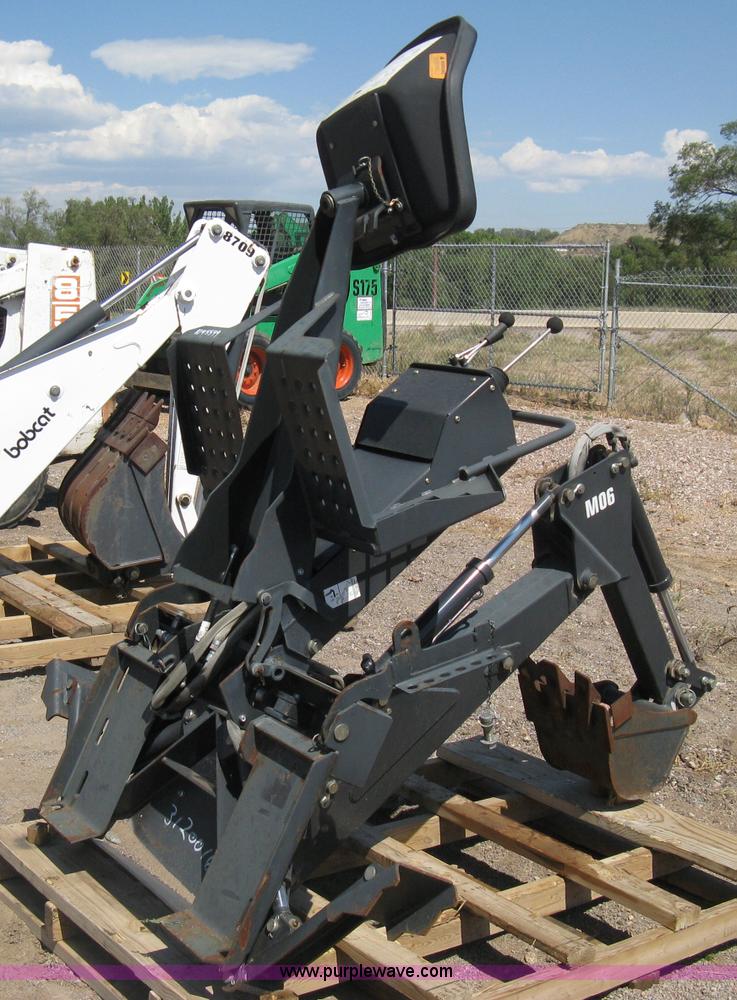 image for item B8090 Bobcat M06 backhoe skid steer attachment