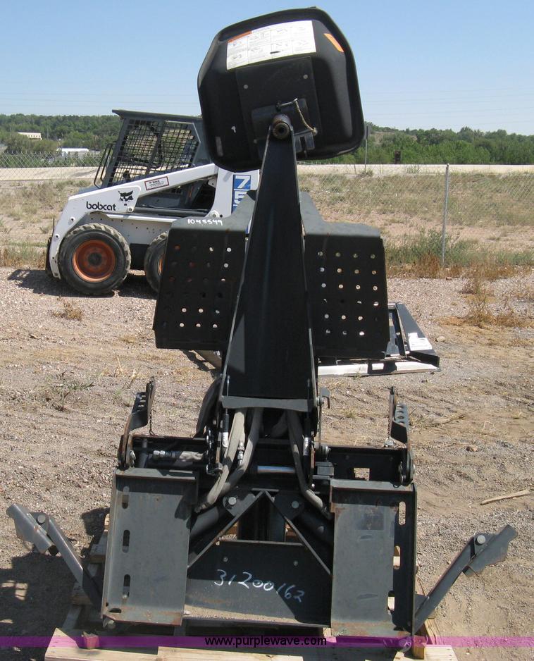 image for item B8090 Bobcat M06 backhoe skid steer attachment