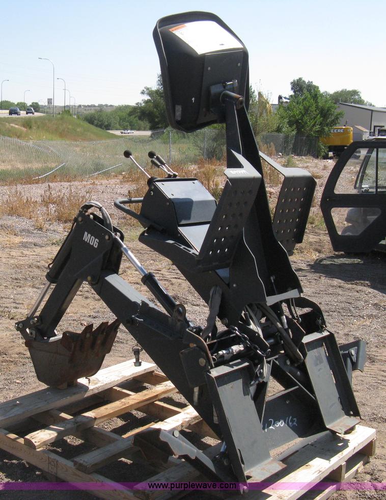 image for item B8090 Bobcat M06 backhoe skid steer attachment