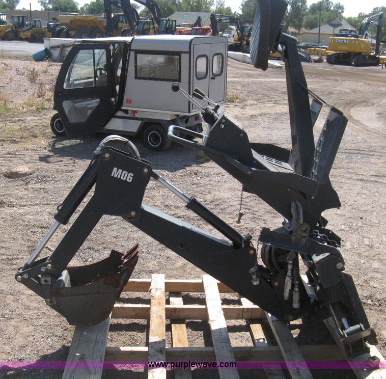 image for item B8090 Bobcat M06 backhoe skid steer attachment