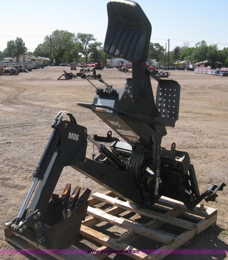 image for item B8090 Bobcat M06 backhoe skid steer attachment