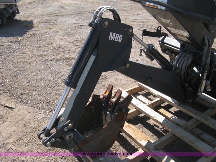 image for item B8090 Bobcat M06 backhoe skid steer attachment