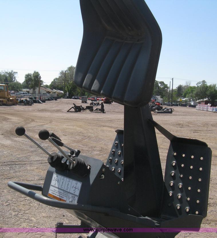 image for item B8090 Bobcat M06 backhoe skid steer attachment