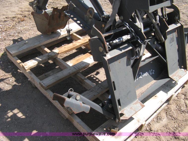 image for item B8090 Bobcat M06 backhoe skid steer attachment