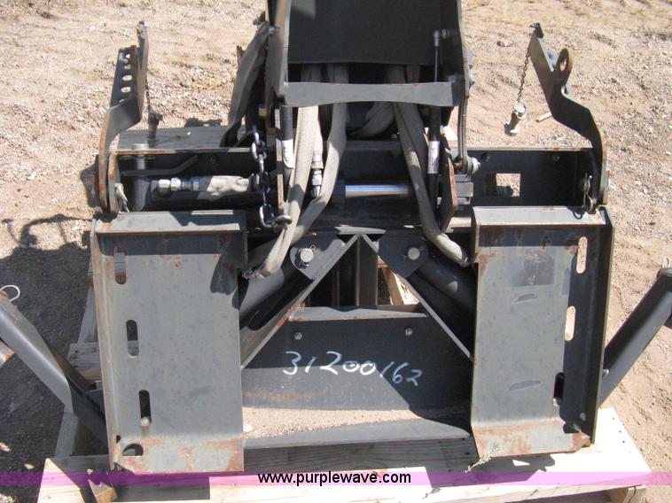 image for item B8090 Bobcat M06 backhoe skid steer attachment