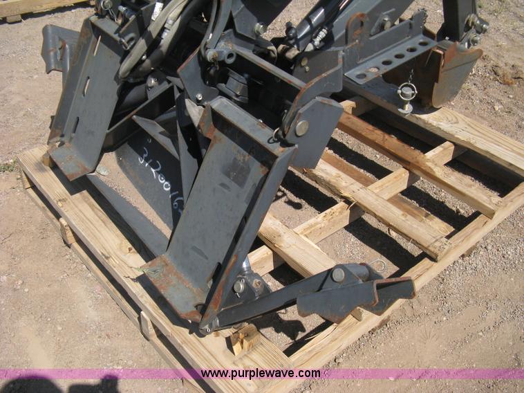image for item B8090 Bobcat M06 backhoe skid steer attachment