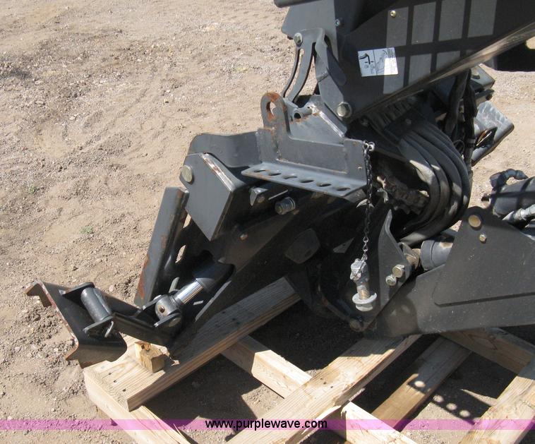 image for item B8090 Bobcat M06 backhoe skid steer attachment