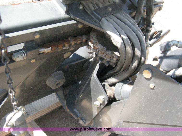 image for item B8090 Bobcat M06 backhoe skid steer attachment