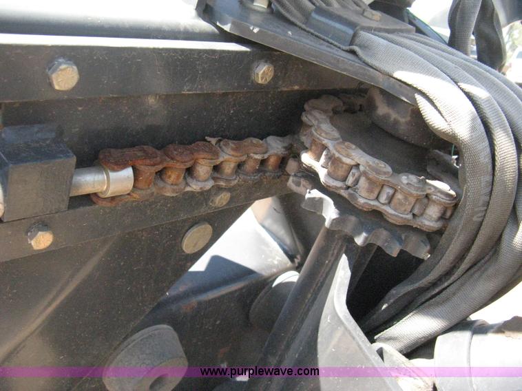 image for item B8090 Bobcat M06 backhoe skid steer attachment