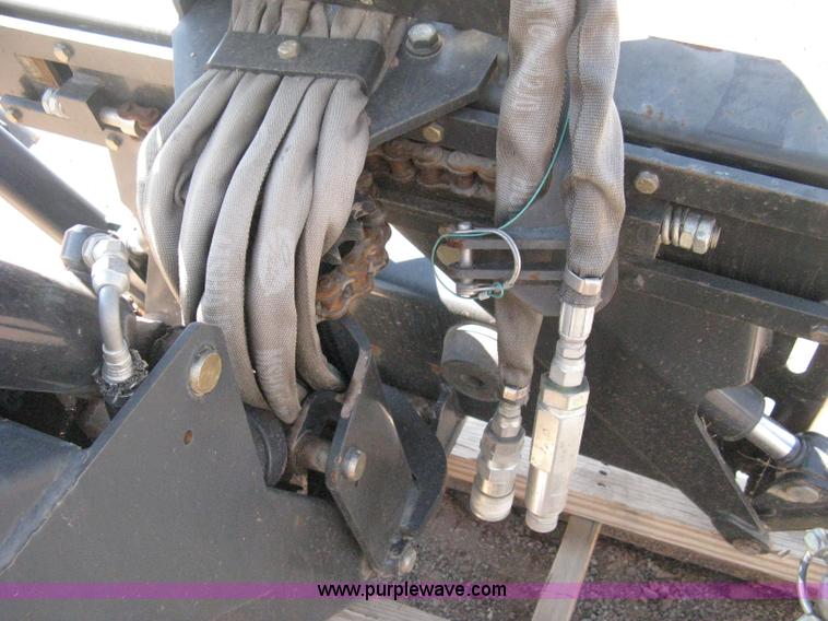 image for item B8090 Bobcat M06 backhoe skid steer attachment