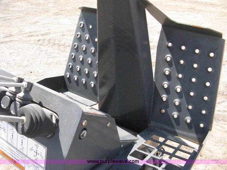 image for item B8090 Bobcat M06 backhoe skid steer attachment