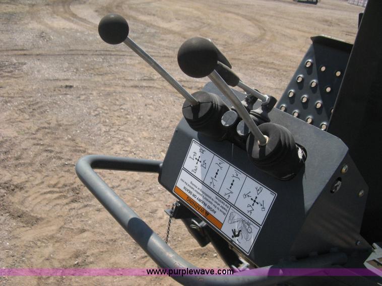 image for item B8090 Bobcat M06 backhoe skid steer attachment