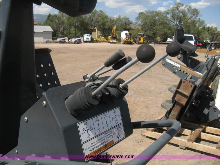 image for item B8090 Bobcat M06 backhoe skid steer attachment