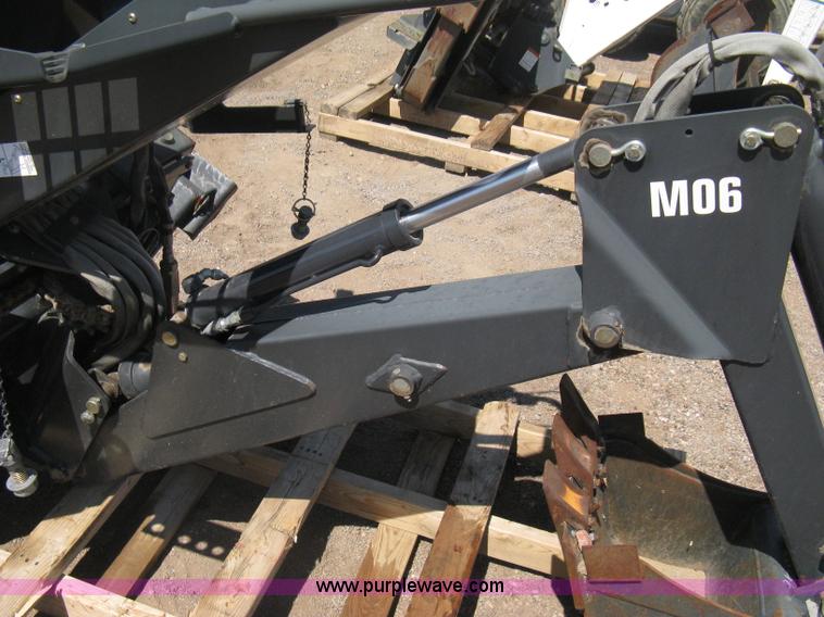 image for item B8090 Bobcat M06 backhoe skid steer attachment