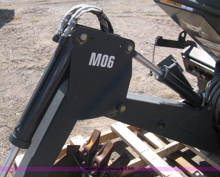 image for item B8090 Bobcat M06 backhoe skid steer attachment
