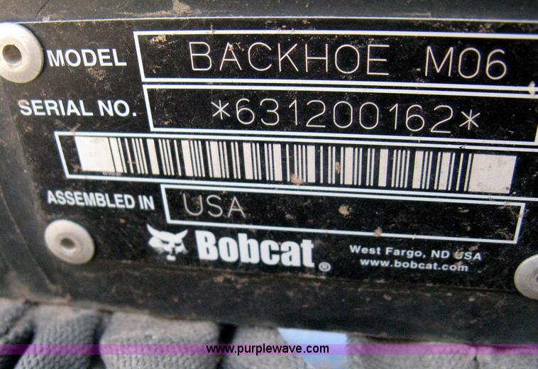 image for item B8090 Bobcat M06 backhoe skid steer attachment