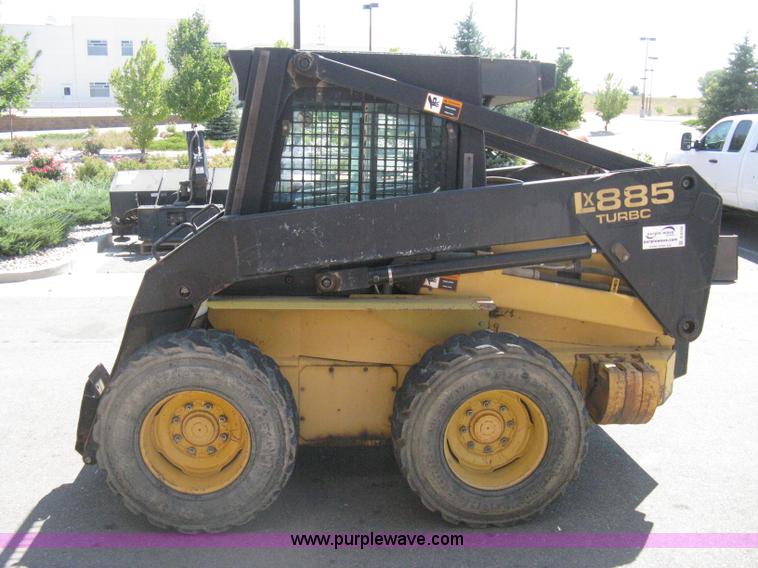image for item B8106 1997 New Holland LX885 Turbo Super Boom skid steer