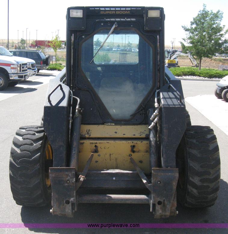 image for item B8106 1997 New Holland LX885 Turbo Super Boom skid steer