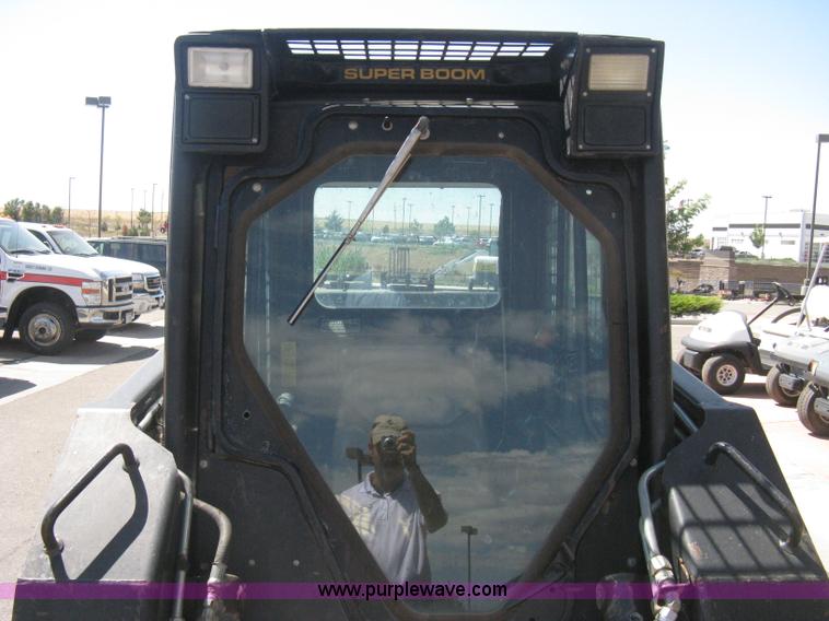 image for item B8106 1997 New Holland LX885 Turbo Super Boom skid steer