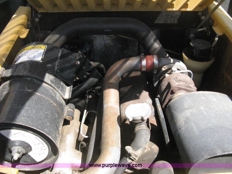 image for item B8106 1997 New Holland LX885 Turbo Super Boom skid steer