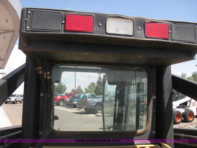 image for item B8106 1997 New Holland LX885 Turbo Super Boom skid steer