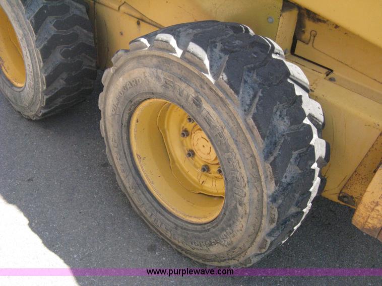image for item B8106 1997 New Holland LX885 Turbo Super Boom skid steer