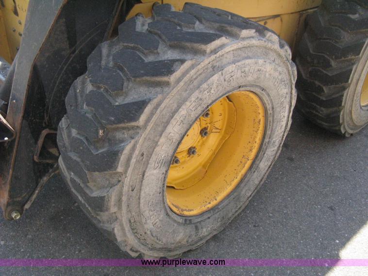 image for item B8106 1997 New Holland LX885 Turbo Super Boom skid steer