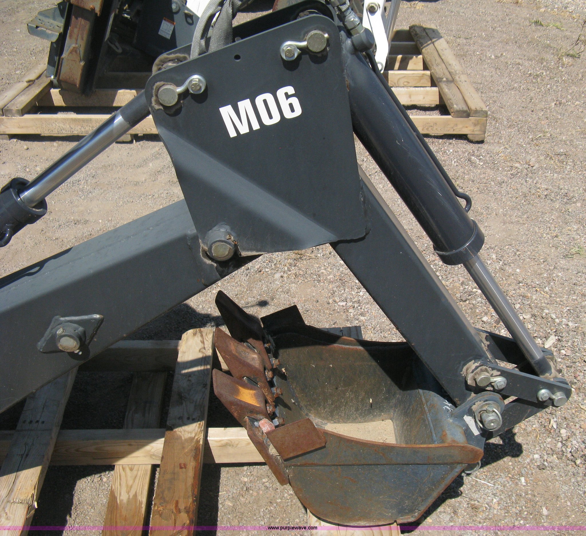 Bobcat M06 backhoe skid steer attachment in Colorado Springs, CO Item B8090 sold Purple Wave