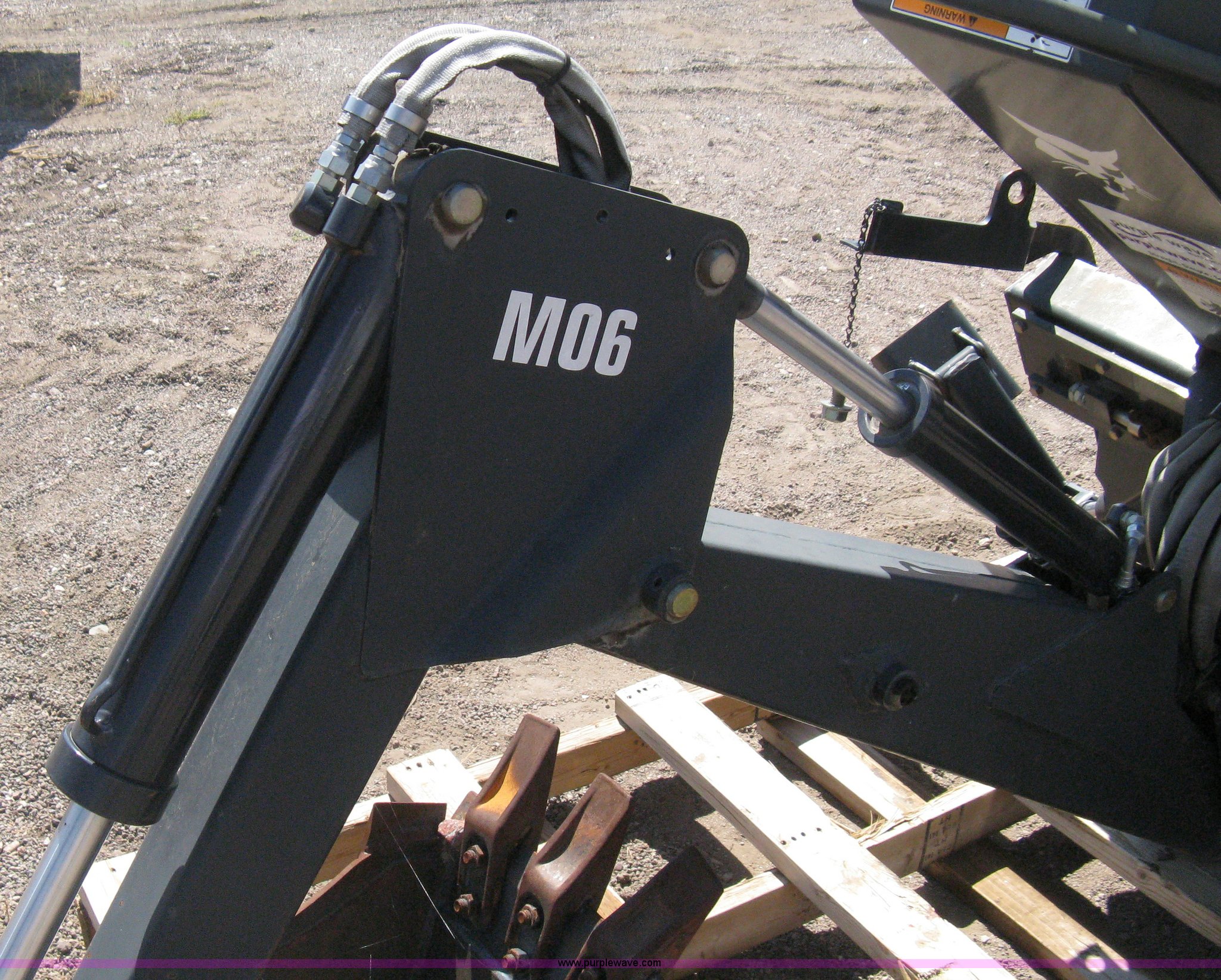 Bobcat M06 backhoe skid steer attachment in Colorado Springs, CO Item B8090 sold Purple Wave