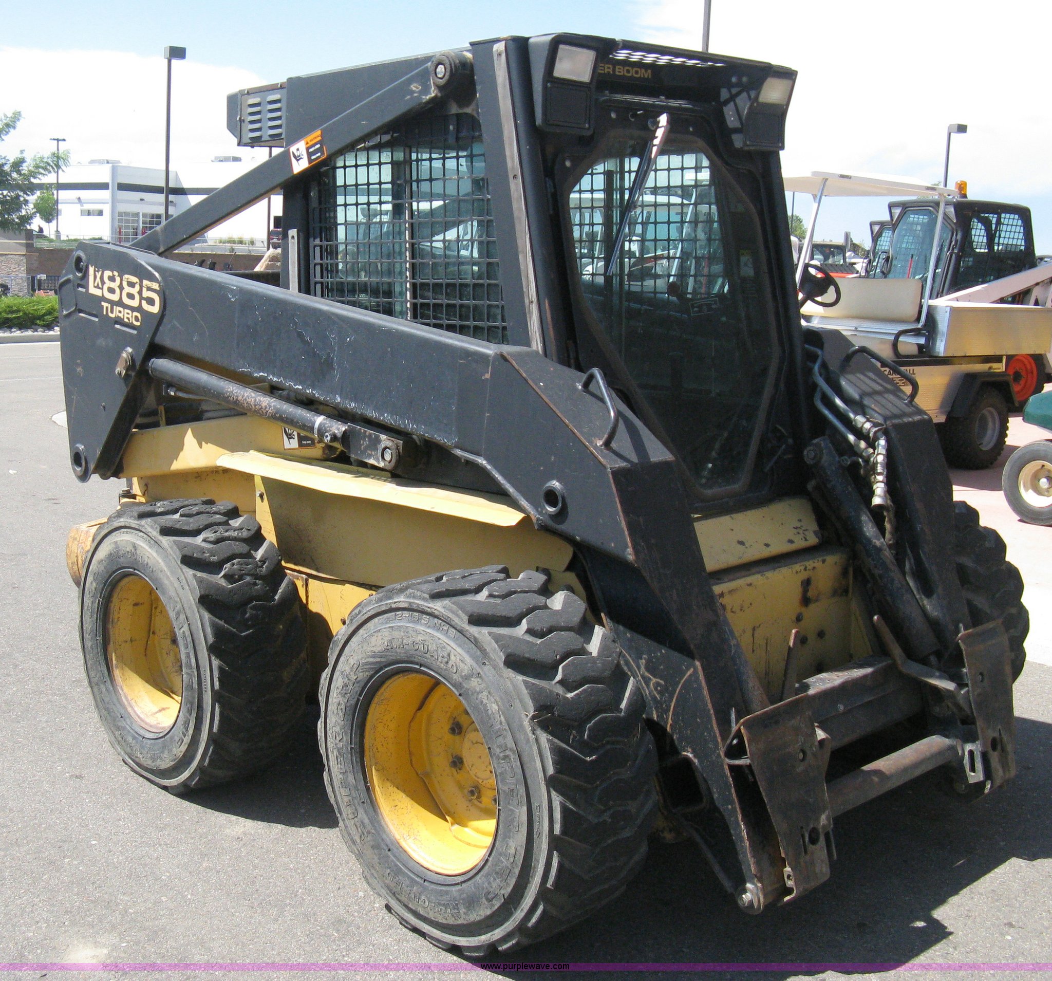 1997 New Holland LX885 Turbo Super Boom skid steer in Windsor, CO