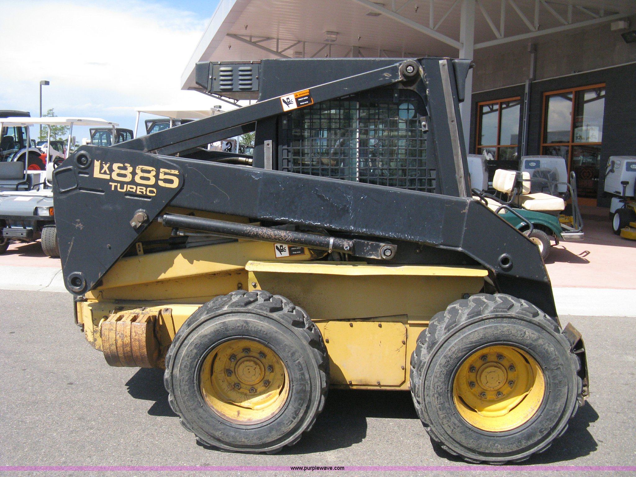 1997 New Holland LX885 Turbo Super Boom skid steer in Windsor, CO