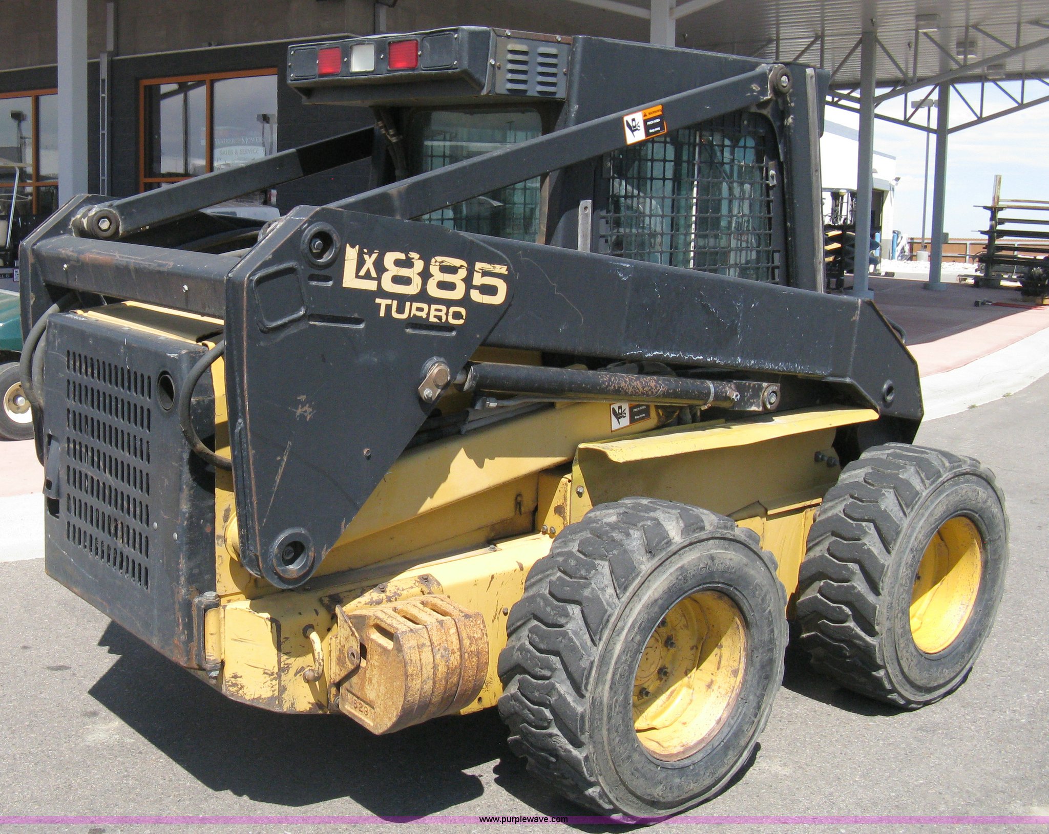 1997 New Holland LX885 Turbo Super Boom skid steer in Windsor, CO