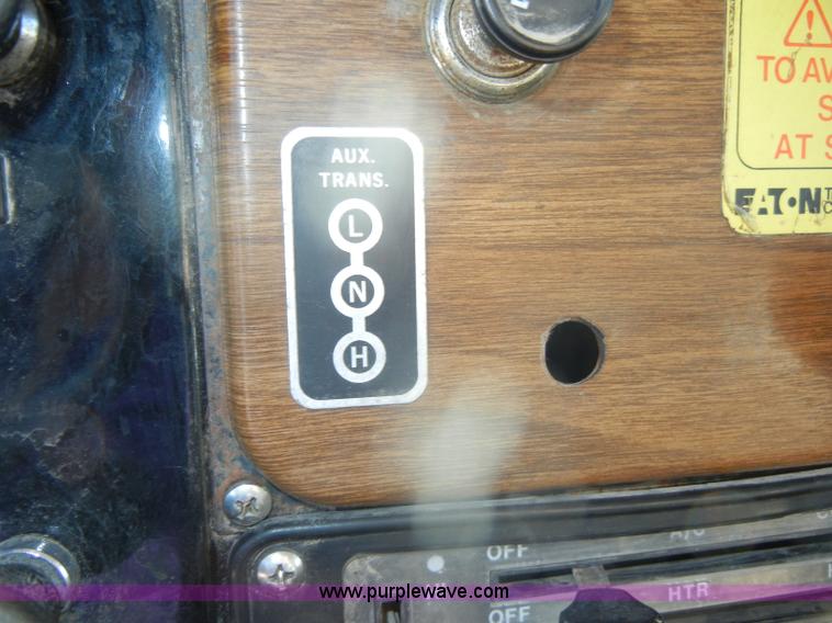 image for item D4619 1982 International 1754 Easy-Rider 1600C Loral spreader truck