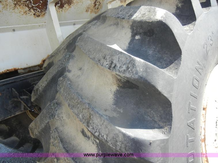 image for item D4619 1982 International 1754 Easy-Rider 1600C Loral spreader truck