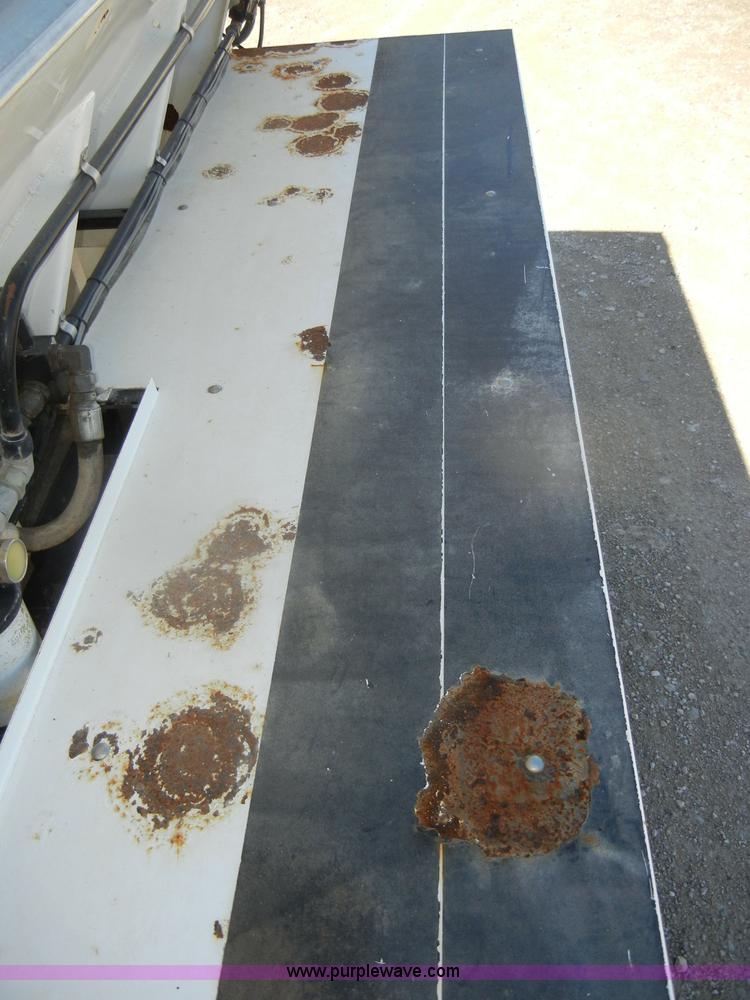 image for item D4619 1982 International 1754 Easy-Rider 1600C Loral spreader truck