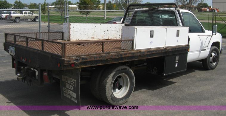 image for item B8113 1998 GMC Sierra 3500 SL flatbed pickup truck