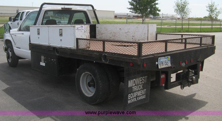 image for item B8113 1998 GMC Sierra 3500 SL flatbed pickup truck