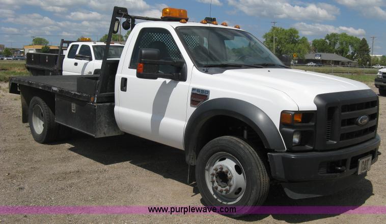 image for item B8119 2008 Ford F550 Super Duty flatbed pickup truck