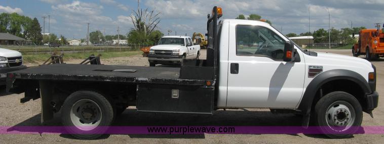 image for item B8119 2008 Ford F550 Super Duty flatbed pickup truck
