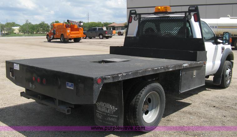 image for item B8119 2008 Ford F550 Super Duty flatbed pickup truck