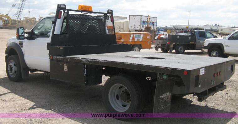 image for item B8119 2008 Ford F550 Super Duty flatbed pickup truck