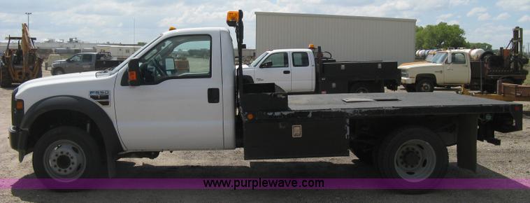 image for item B8119 2008 Ford F550 Super Duty flatbed pickup truck