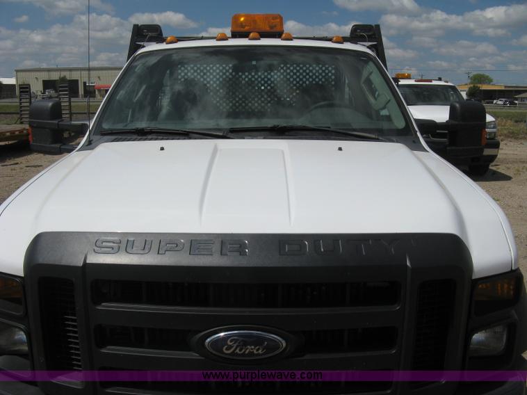 image for item B8119 2008 Ford F550 Super Duty flatbed pickup truck