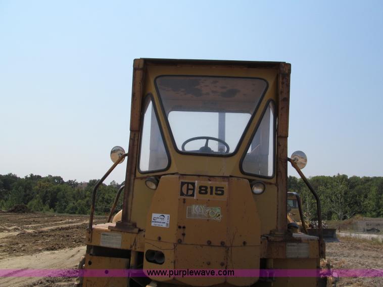 image for item E2090 1971 Caterpillar 815 articulating dirt compactor