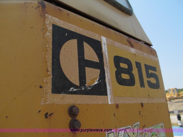 image for item E2090 1971 Caterpillar 815 articulating dirt compactor