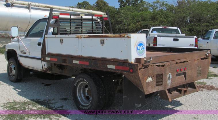 image for item E2102 1998 Dodge Ram 3500 Laramie SLT flatbed pickup truck