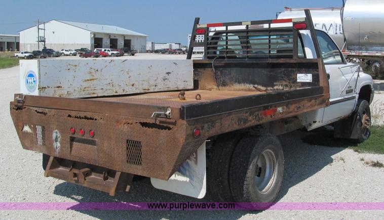 image for item E2102 1998 Dodge Ram 3500 Laramie SLT flatbed pickup truck