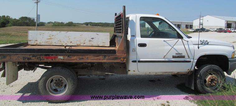image for item E2102 1998 Dodge Ram 3500 Laramie SLT flatbed pickup truck
